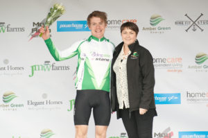 29th of April, 2017; Christopher McGlinchey, Cycling Ulster, receives the award for third place from Paula Nugent, Tour of Ulster, on the awards podium at the finish of Stage 1 of the AmberGreen Energy Tour of Ulster. Moy, Co. Tyrone. Picture credit: Stephen McMahon / Tour of Ulster