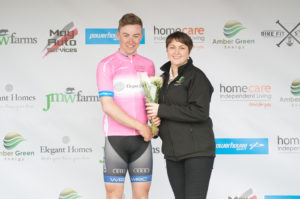 29th of April, 2017; Stage winner Darragh O’Mahoney, Waterford Racing Club, with Paula Nugent, Tour of Ulster, on the awards podium at the finish of Stage 1 of the AmberGreen Energy Tour of Ulster. Moy, Co. Tyrone. Picture credit: Stephen McMahon / Tour of Ulster