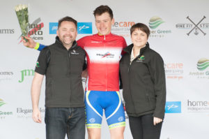 29th of April, 2017; Conn McDunphy, Stagg Cycles Lucan Cycling Road Club, receives the red jersey of best placed Young Rider from Neil O’Brien, AmberGreen Energy, left, and Paula Nugent, Tour of Ulster, on the awards podium at the finish of Stage 1 of the AmberGreen Energy Tour of Ulster. Moy, Co. Tyrone. Picture credit: Stephen McMahon / Tour of Ulster